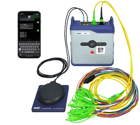 Picture of the VeEX OTT with the 16x fan out optical cable, GNSS+LTE antenna and controlling mobile phone