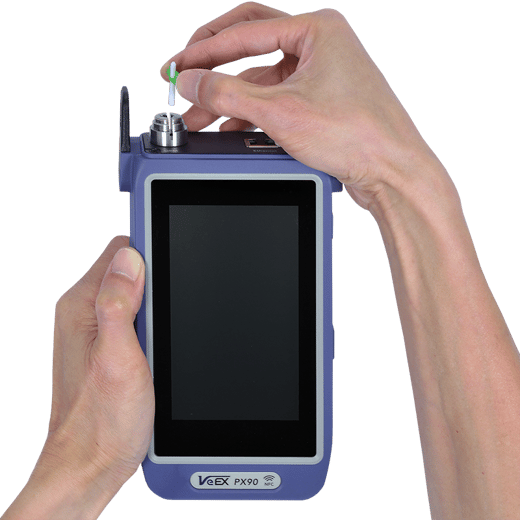 Inserting VeEX's field-replaceable ferrule of an optical test port on a V90-series test set.