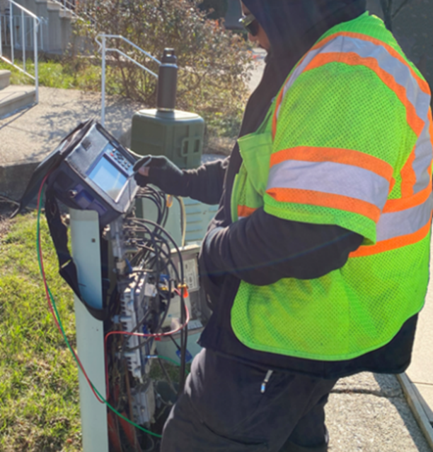 Picture of a technician using VeEX's CX380C to measure the sweep signals injected by a portable SWP-BOX